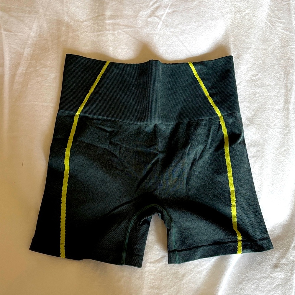 HIIT deep turquoise biker shorts with like green stripes